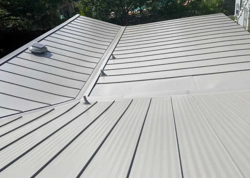 Solar attic fan installed on a metal roof for Roof Ventilation in Clearwater